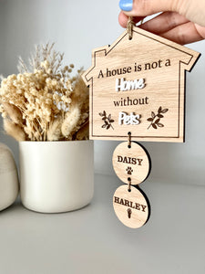 A house is not a home pet plaque