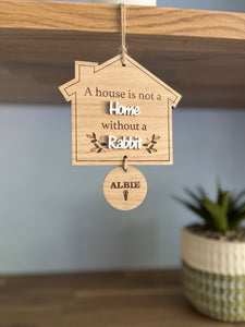 A house is not a home plaque